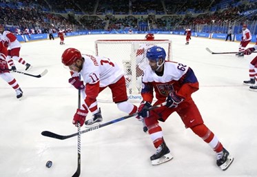 GANGNEUNG, SOUTH KOREA - FEBRUARY 23: The Czech Republic's Michal Repik #62 and Sergei Andronov #11 of the Olympic Athletes from Russia battle for the puck while Bogdan Kiselvich #55 and Vyacheslav Voinov #26 look on during semifinal round action at the PyeongChang 2018 Olympic Winter Games. (Photo by Andre Ringuette/HHOF-IIHF Images)


